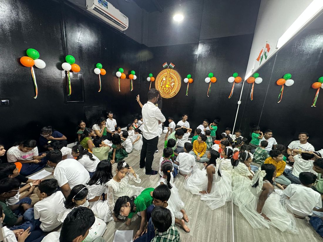 Students gathered in the dance studio, decorated for a cultural programme rehearsal
