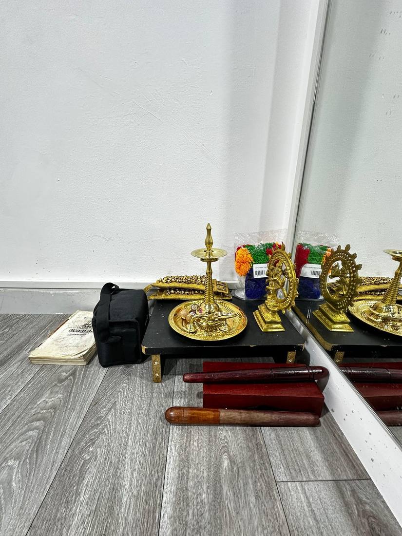 Classical dance and music essentials including ghungroo anklets and a Nataraja idol