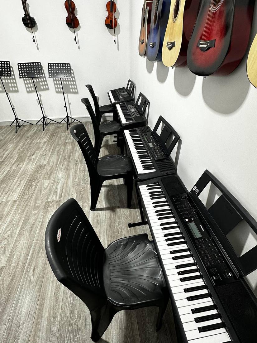 Row of keyboards set up for lessons at Harmony Music Training Centre